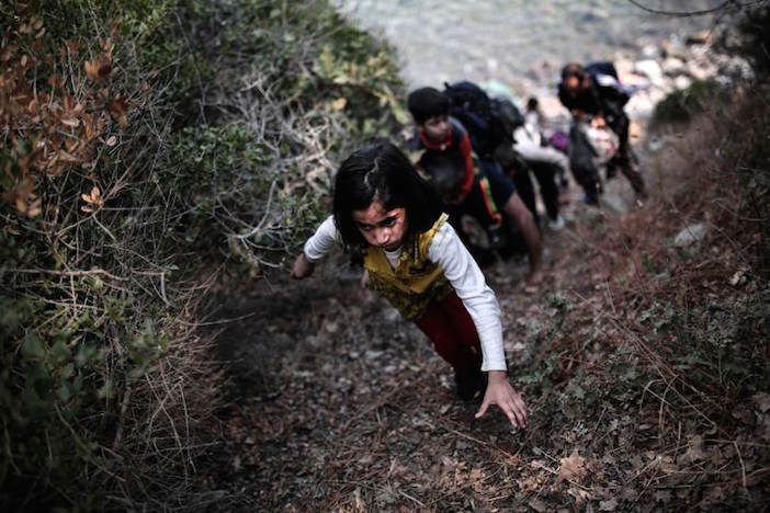 One of Angelos Tzortzinis' award-winning photos: A child tries to climb a slope after arriving on the shores of the Greek island Lesbos in an inflatable dingy across the Aegean Sea from from Turkey on September 3, 2015. More than 230,000 refugees and migrants have arrived in Greece by sea this year, a huge rise from 17,500 in the same period in 2014, deputy shipping minister Nikos Zois said.AFP PHOTO / ANGELOS TZORTZINIS (Photo credit should read ANGELOS TZORTZINIS/AFP/Getty Images)