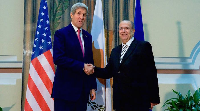 U.S. Secretary of State John Kerry shakes hands with Cyprus Foreign Minister Ioannis Kasoulides on December 3, 2015, after arriving at the Ministry of Foreign Affairs in Nicosia, Cyprus, for a bilateral conversation amid meetings with both Greek and Turkish leaders on the island nation.