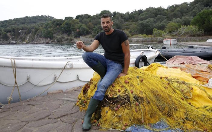 40-year-old fisherman Stratis Valiamos (Photo from Kathimerini)