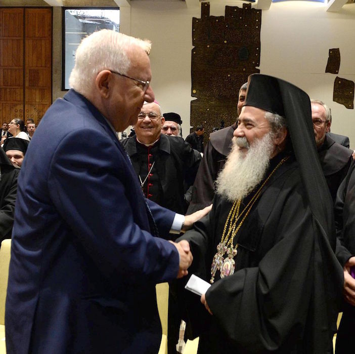 Israeli President Reuven Rivlin speaks with Greek Orthodox Patriarch of Jerusalem Theophilos III at his residence in Jerusalem in honor of the upcoming New Year, on December 27, 2016