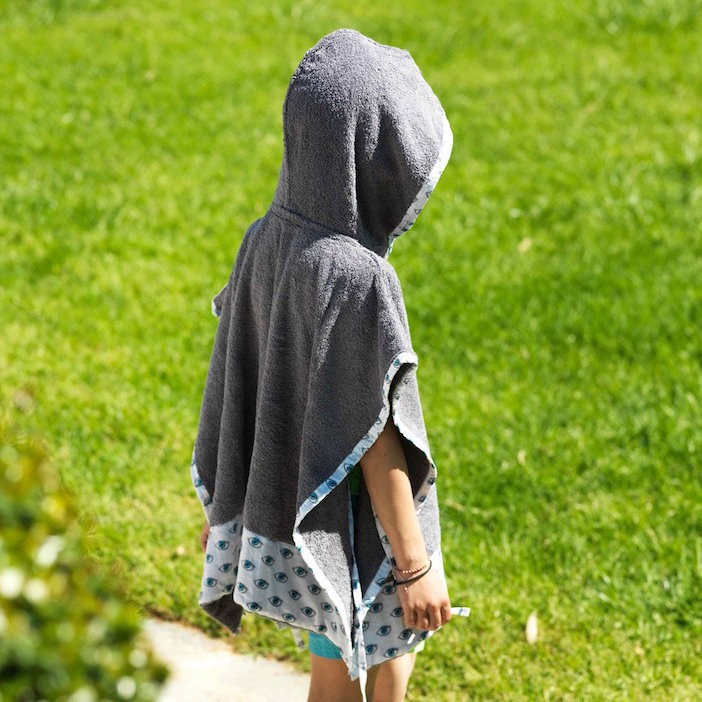 The kids' poncho is a perfect protection from the hot, Australian sun.