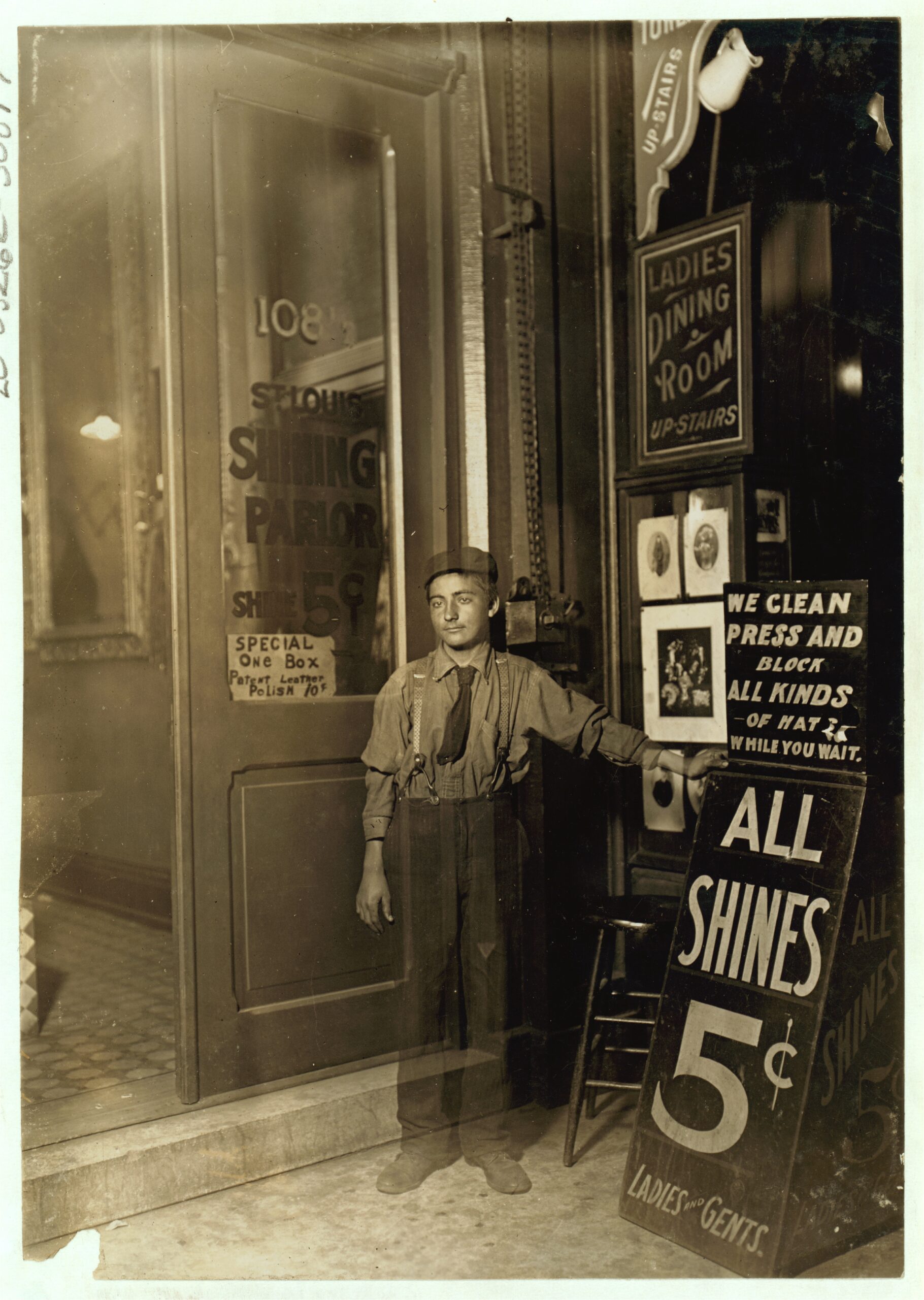 Young Greek bootblack at an Indianapolis shoe-shining parlor at 10 p.m. in 1908
