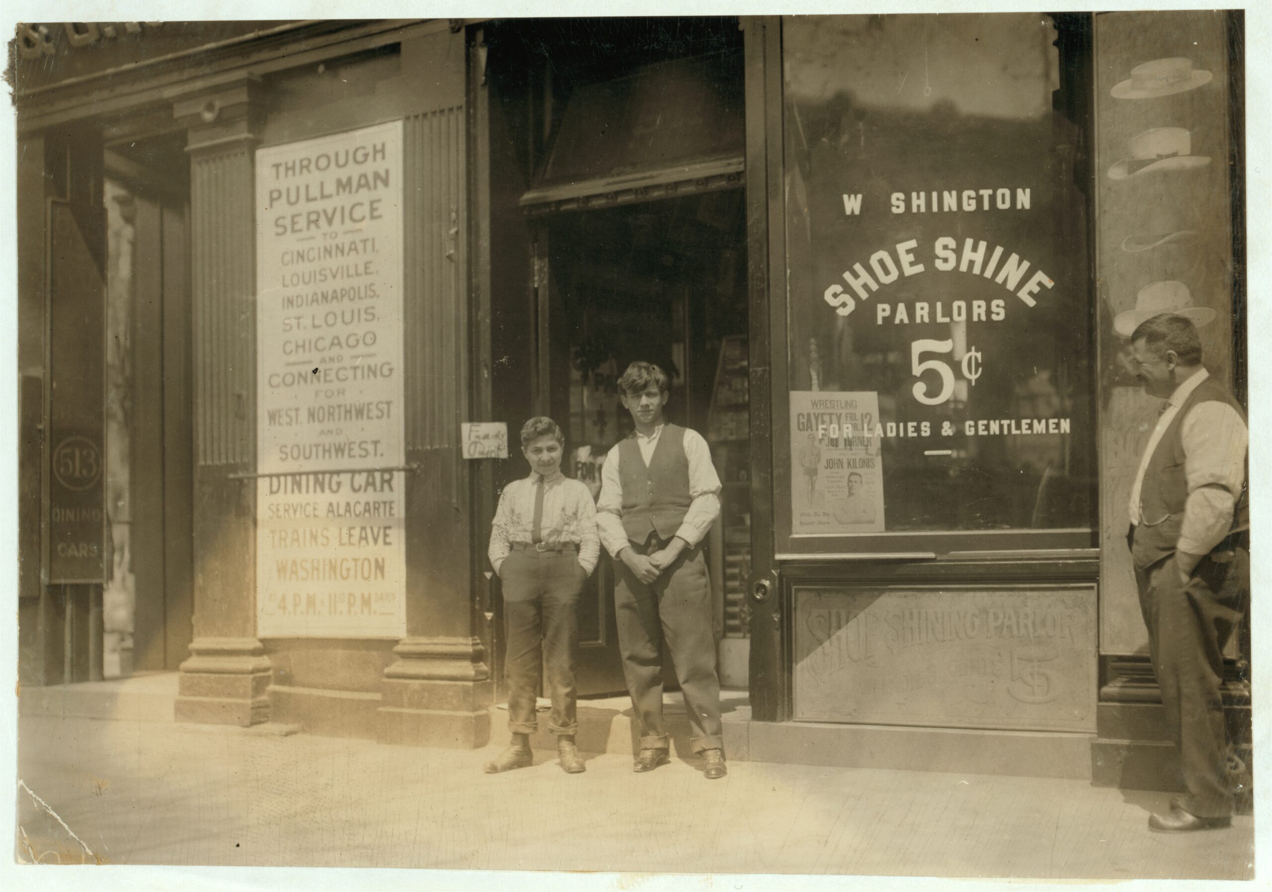 Two boys outside Washington shoe-shine parlors in 1912, including Ciriakos Keiradimos
