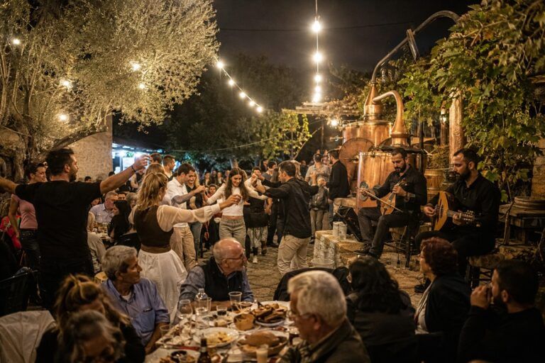 Illustrative image of a traditional Cretan kazani celebration with dancing, live music and a copper still.