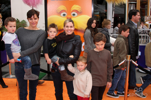 Cat Cora (center) with her wife Jennifer and their four boys